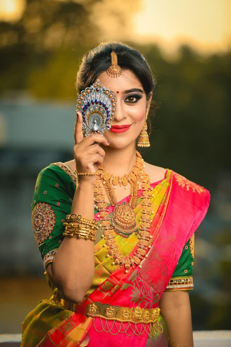 Model wearing traditional gold temple jewellery